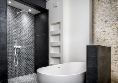 bathroom with natural stone walls