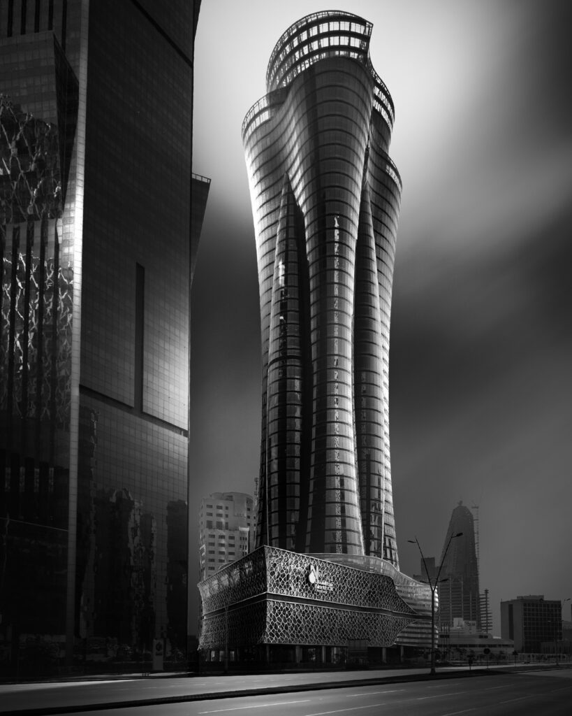 black and white fine art photo of a skyscraper in doha
