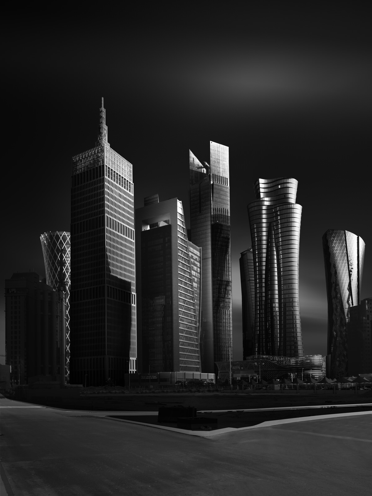 black and white photo of skyscrapers in doha