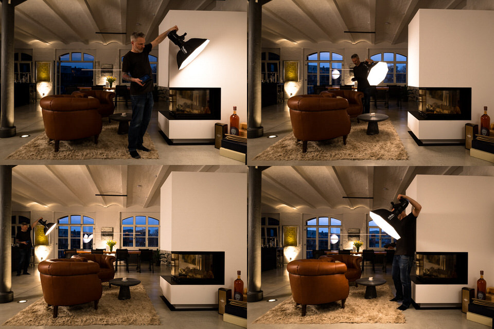 immobilienfotograf in berlin setzt einen blitz in einer wohnung fuer eine innenaufnahme